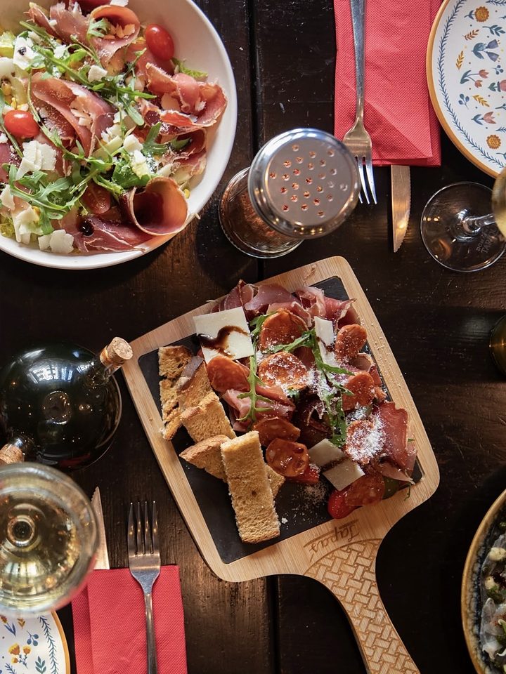 A table laid with antipasti and wine